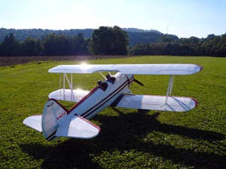 Sun reflections on the beautiful airborne classic biplane